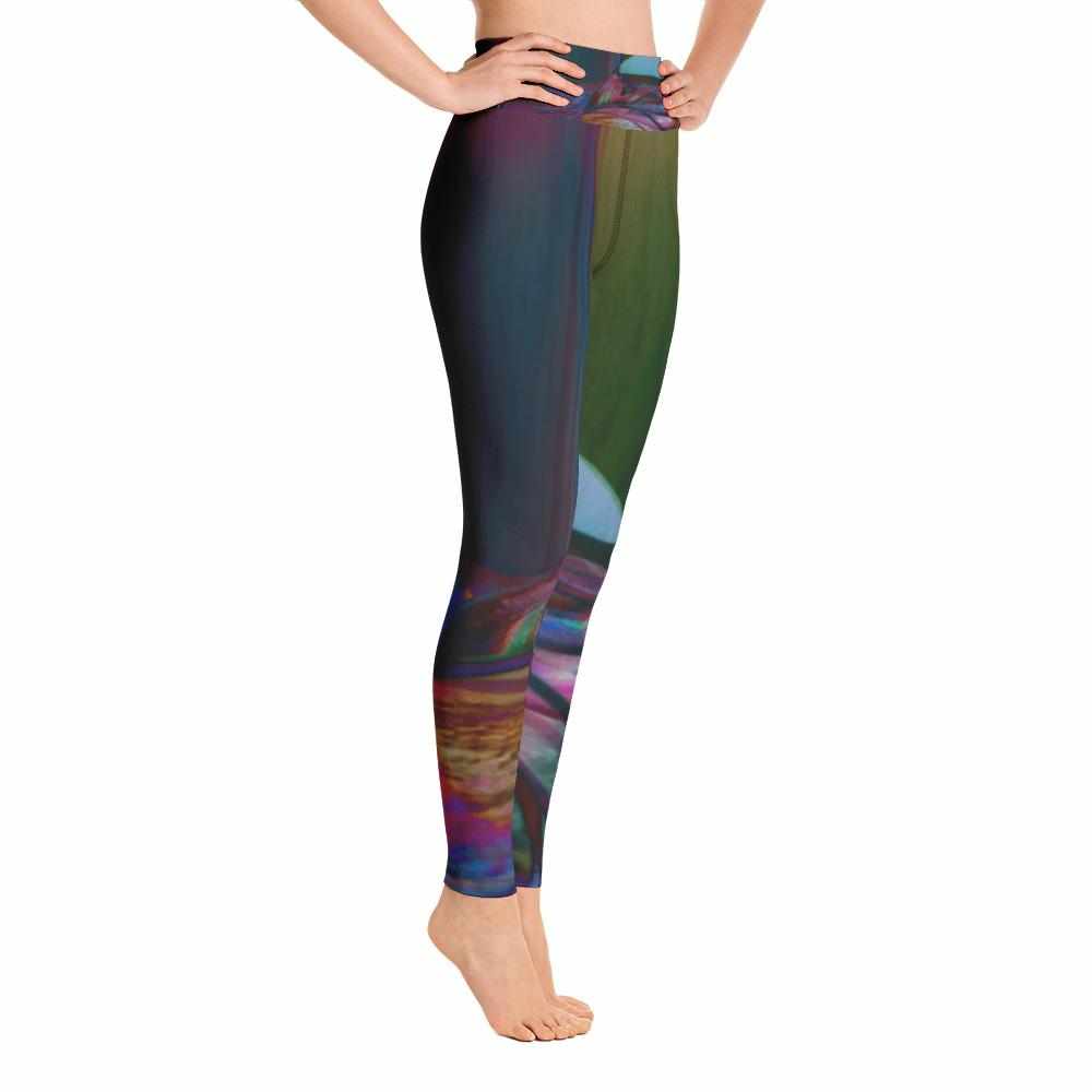 FEMALE MODEL POSING  ON HER TOES IN A UNIQUE PSYCHEDELIC YOGA LEGGING - RIGHT SIDE PICTURE - blue, purple, pink, orange, green yoga legging for women